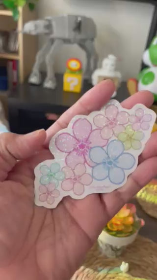 Brighten your gear with our hand-cut rainbow holographic cherry blossom sticker. This 4x2.25 inch pastel sakura cluster decal is waterproof, laminated, and perfect for laptops.